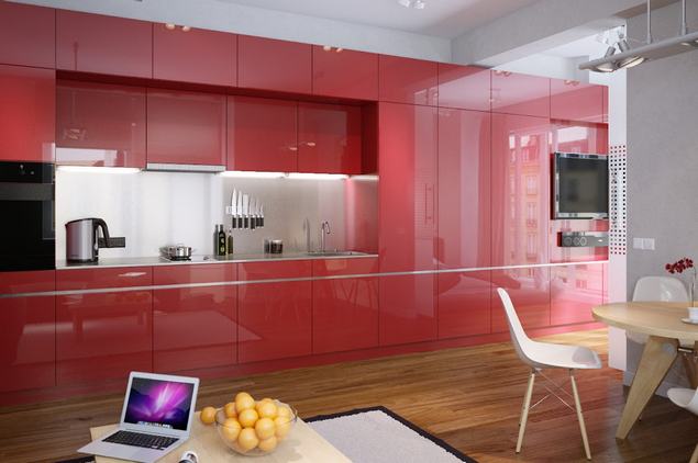 Modern kis lakás piros magasfényű konyhabútorral a középpontban