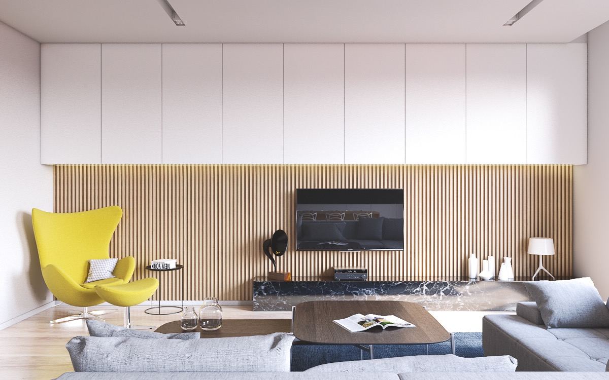 Fa rácsos háttérés sárga fotel teszi érdekessebbé a fehér bútorokkal kialakított TV falat