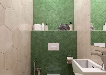 A bézs csempe a falon nagyobb méretű hatszögletű lapokból áll, a WC mögött a fal zöld, kisebb formátumú csempét kapott mutatós formával, a padlóburkolat mintás, a szaniterek fehérek