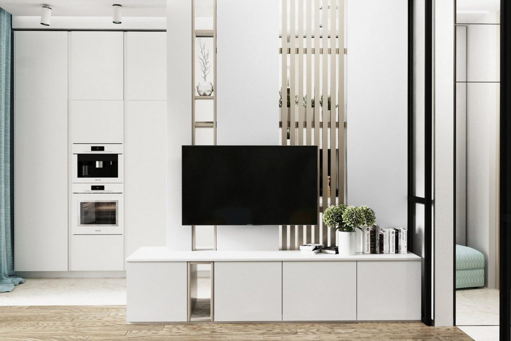 Ügyesen elválasztott fehér konyha modern stílusban berendezett, elegáns 32m2-es lakásban