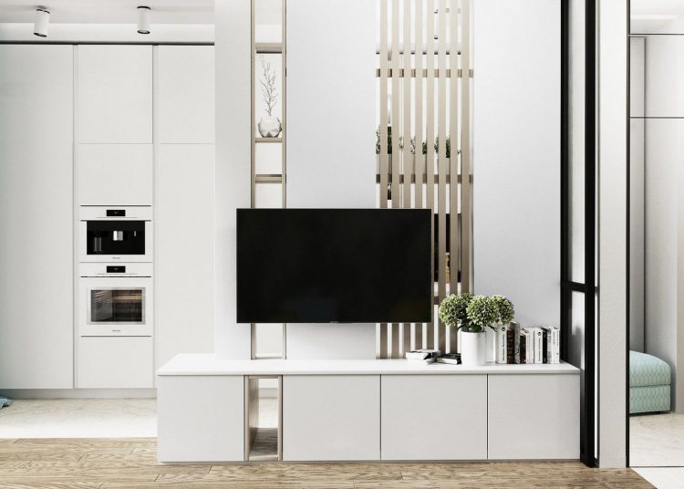 Ügyesen elválasztott fehér konyha modern stílusban berendezett, elegáns 32m2-es lakásban