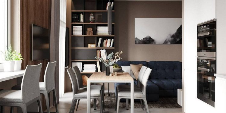 Szép semleges színárnyalatok és egy mélykék kanapé fehérrel kombinálva egyszobás lakásban