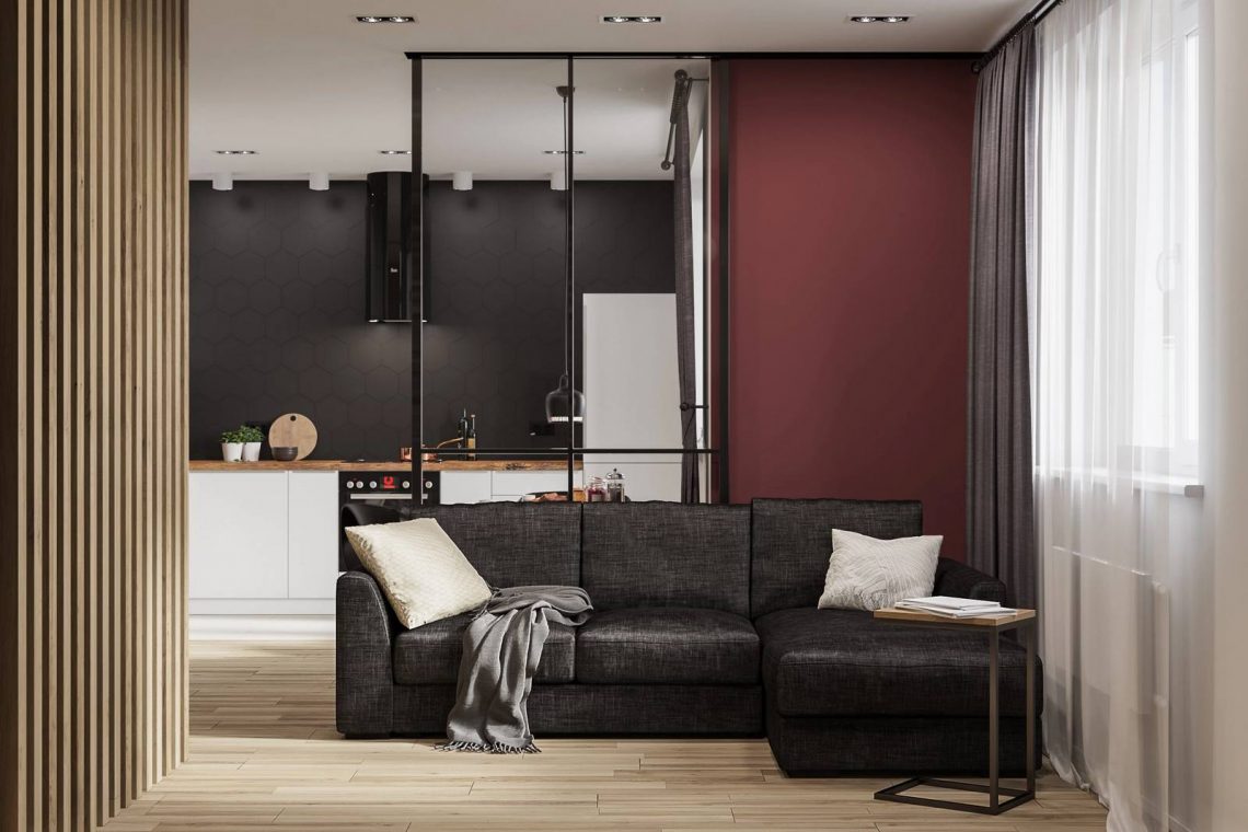 Férfi egyedi hangulattal berendezett modern otthona dizájnos és sötét elemekkel