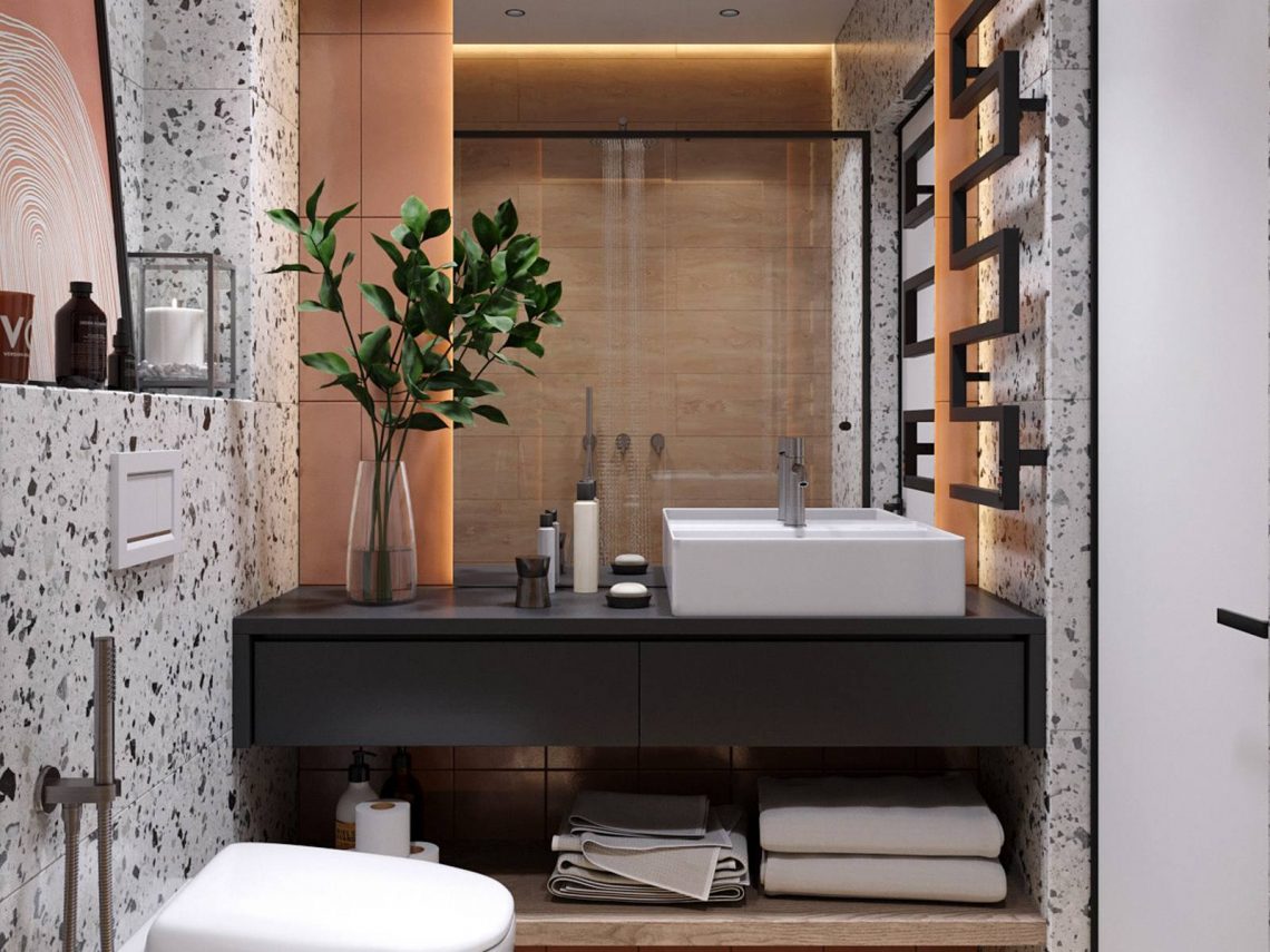 Modern, letisztult kis lakás berendezés, melyet fehér terrazzo burkolattal tettek különlegessé