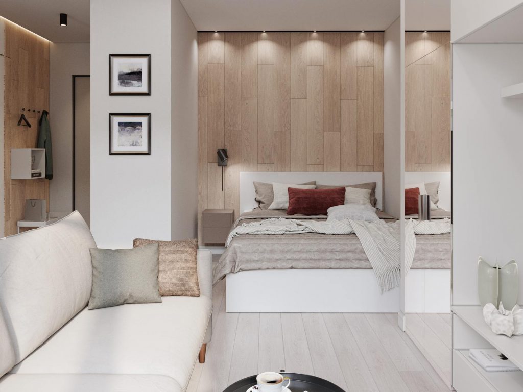 Fehér falak, meleg fa textúrák, márvány minta és tükrök szép kombinációja 33m2-es, egyszobás lakásban