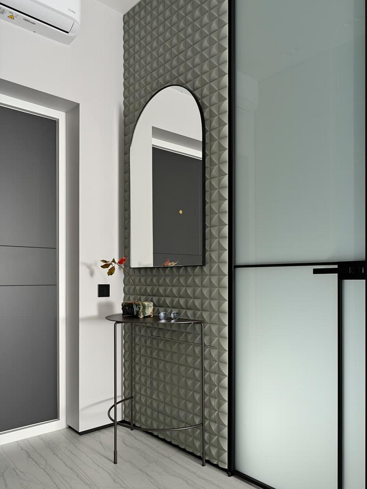 3D falpanel a fő dekorelem a fiatal férfinak berendezett modern lakásban 3D falpanel a fő dekorelem a fiatal férfinak berendezett modern lakásban