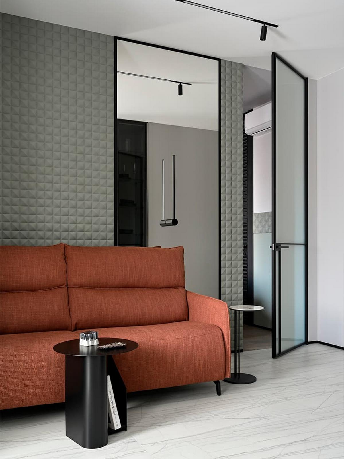 3D falpanel a fő dekorelem a fiatal férfinak berendezett modern lakásban 3D falpanel a fő dekorelem a fiatal férfinak berendezett modern lakásban