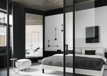 Fekete-fehér berendezés, beton mennyezet és kontrasztok játéka nő 60m2-es lakásában