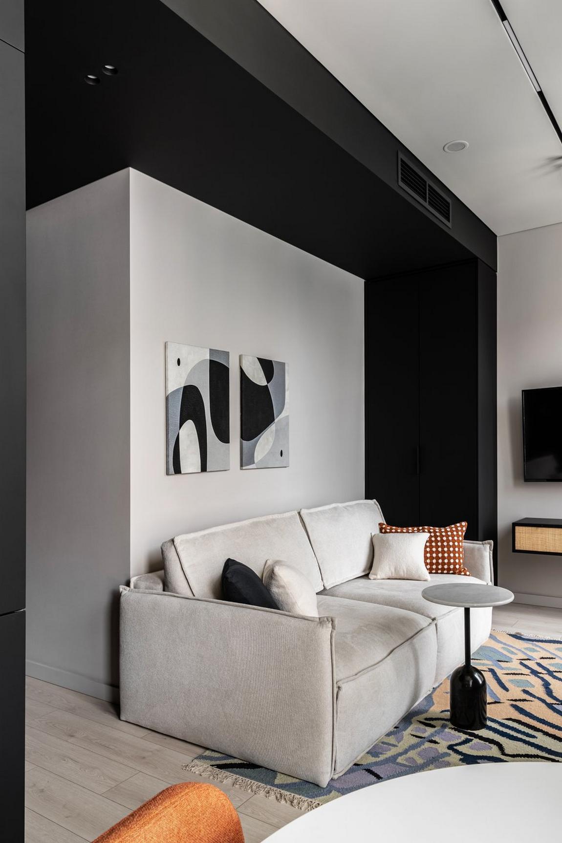 Bevállaltak néhány merész fekete felületet ebben a kis lakásban Bevállaltak néhány merész fekete felületet ebben a kis lakásban