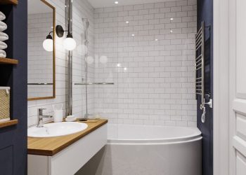 Kádparaván és íves, asszimetrikus fürdőkád, mintás padlóburkolat, sötétkék fal és épített fürdőszoba bútor