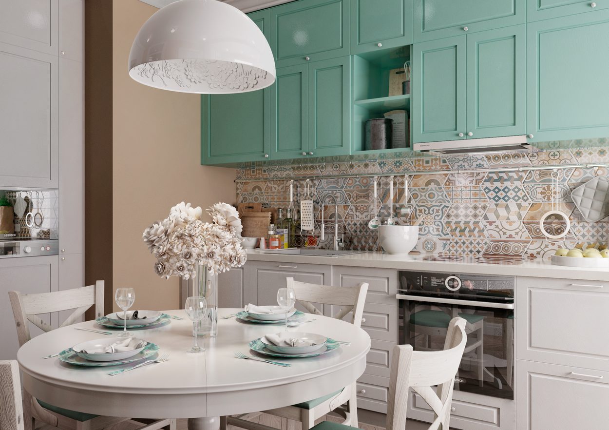 konyha pasztell szinekkel diszitve kerek etkezoasztal kanape zold bezs feher 02