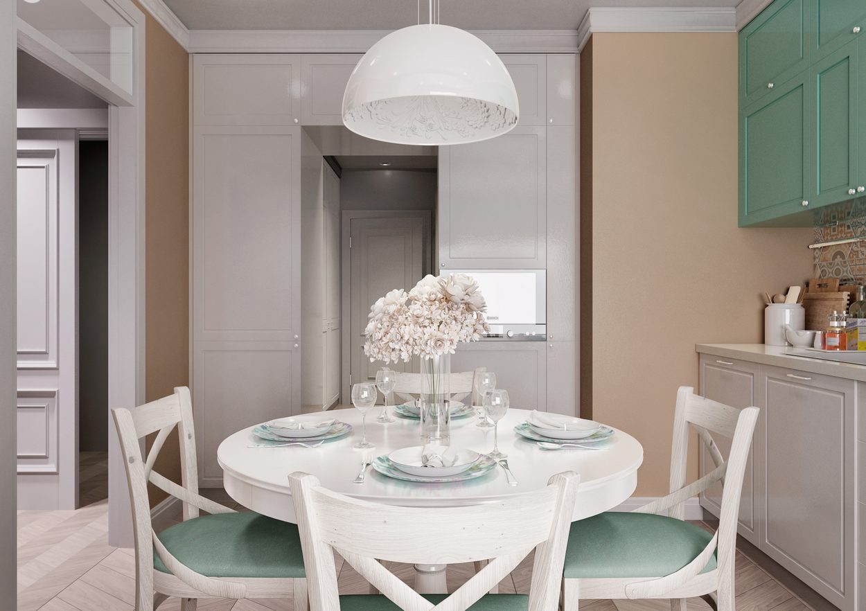 konyha pasztell szinekkel diszitve kerek etkezoasztal kanape zold bezs feher 04